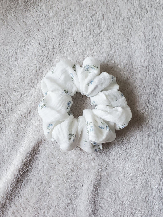 white scrunchie with dainty blue flowers
