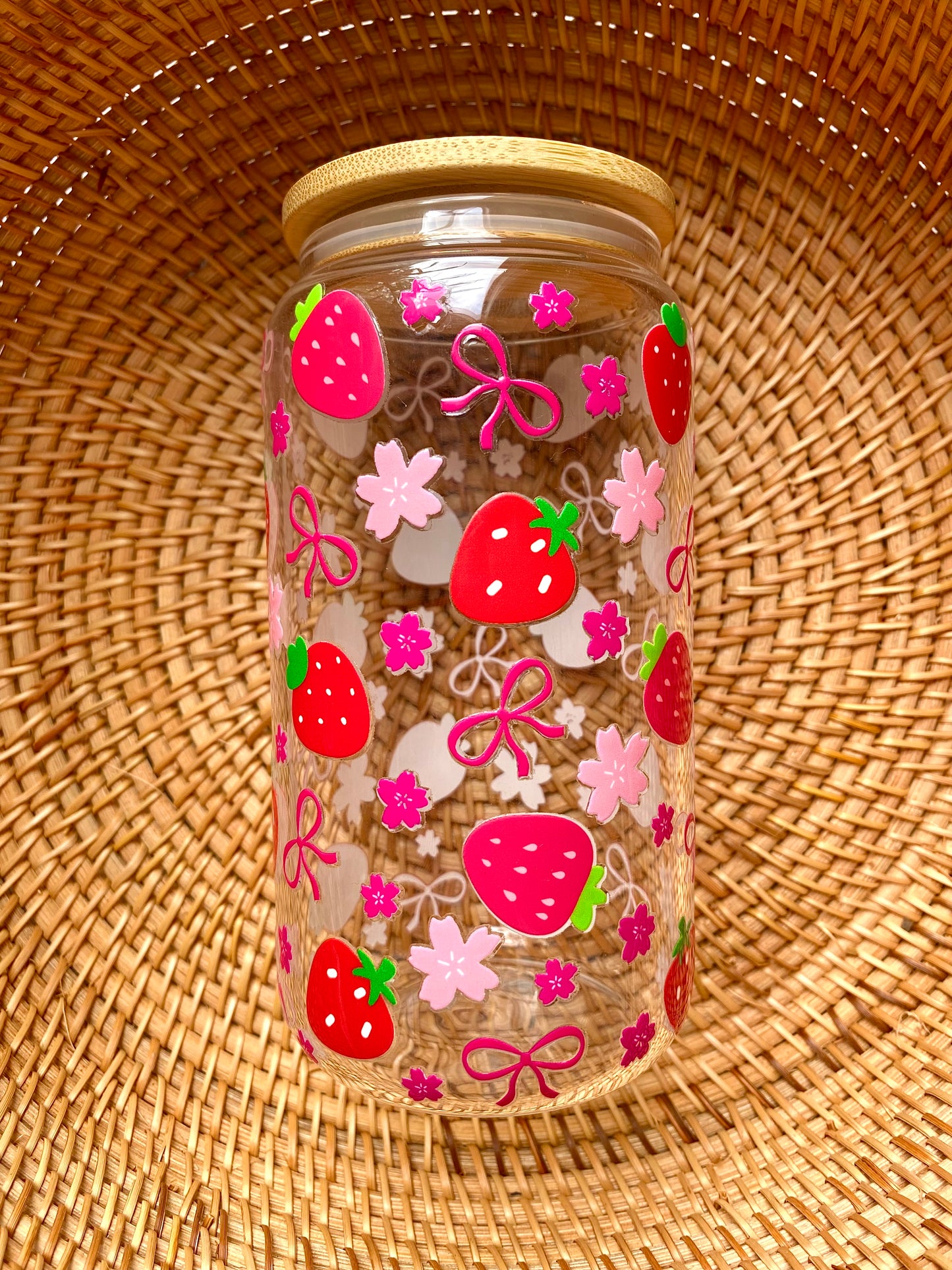 Pink and red strawberries cover the length of this 16oz glass cup. Accented with cherry blossom flowers and cute pink bows.