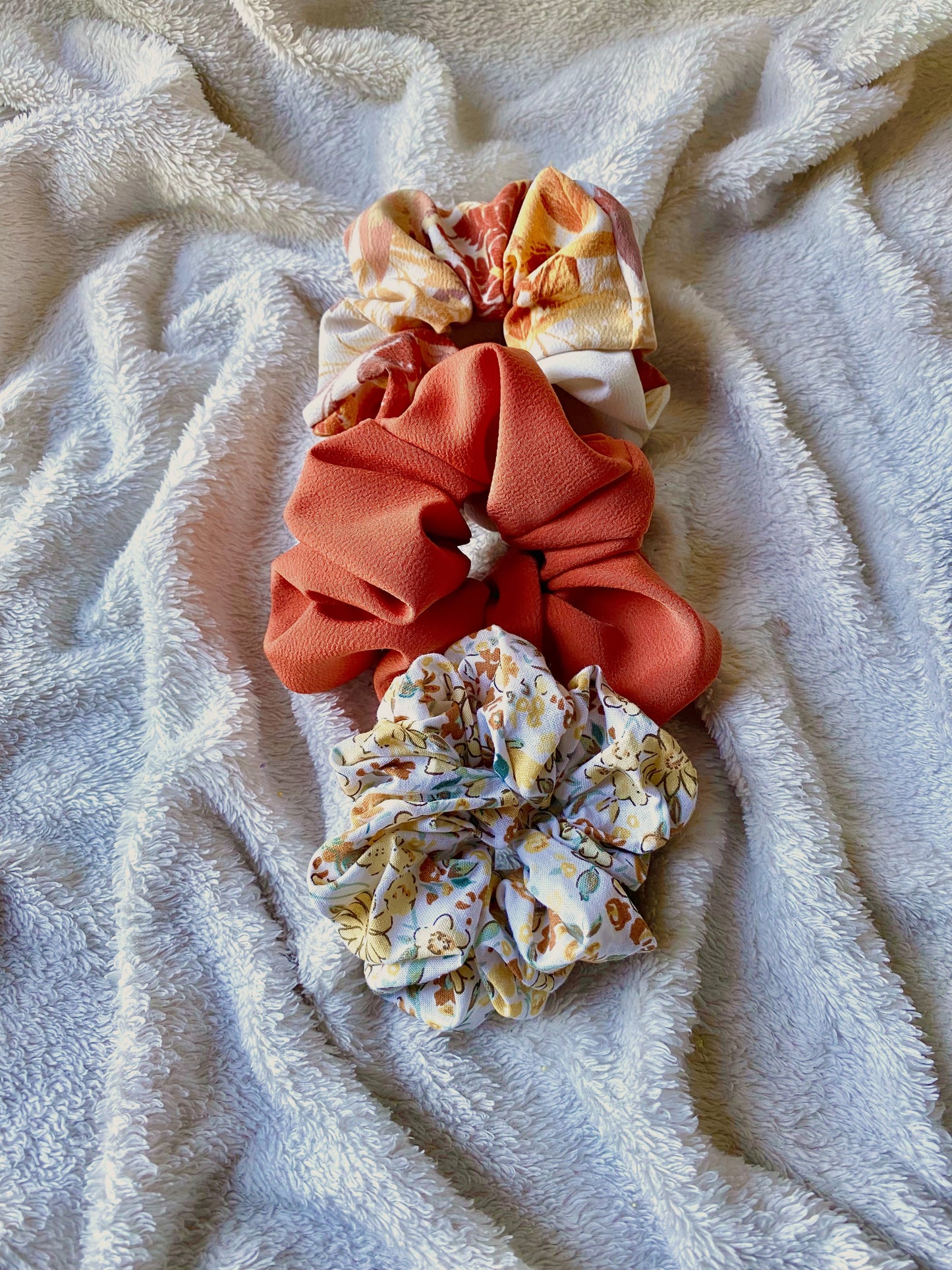 Medium sized scrunchie. Bold, solid, orange color.