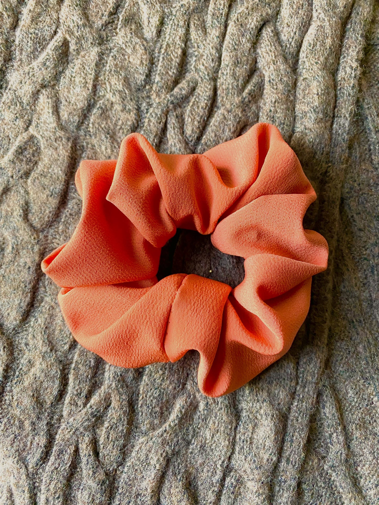 Medium sized scrunchie. Bold, solid, orange color.
