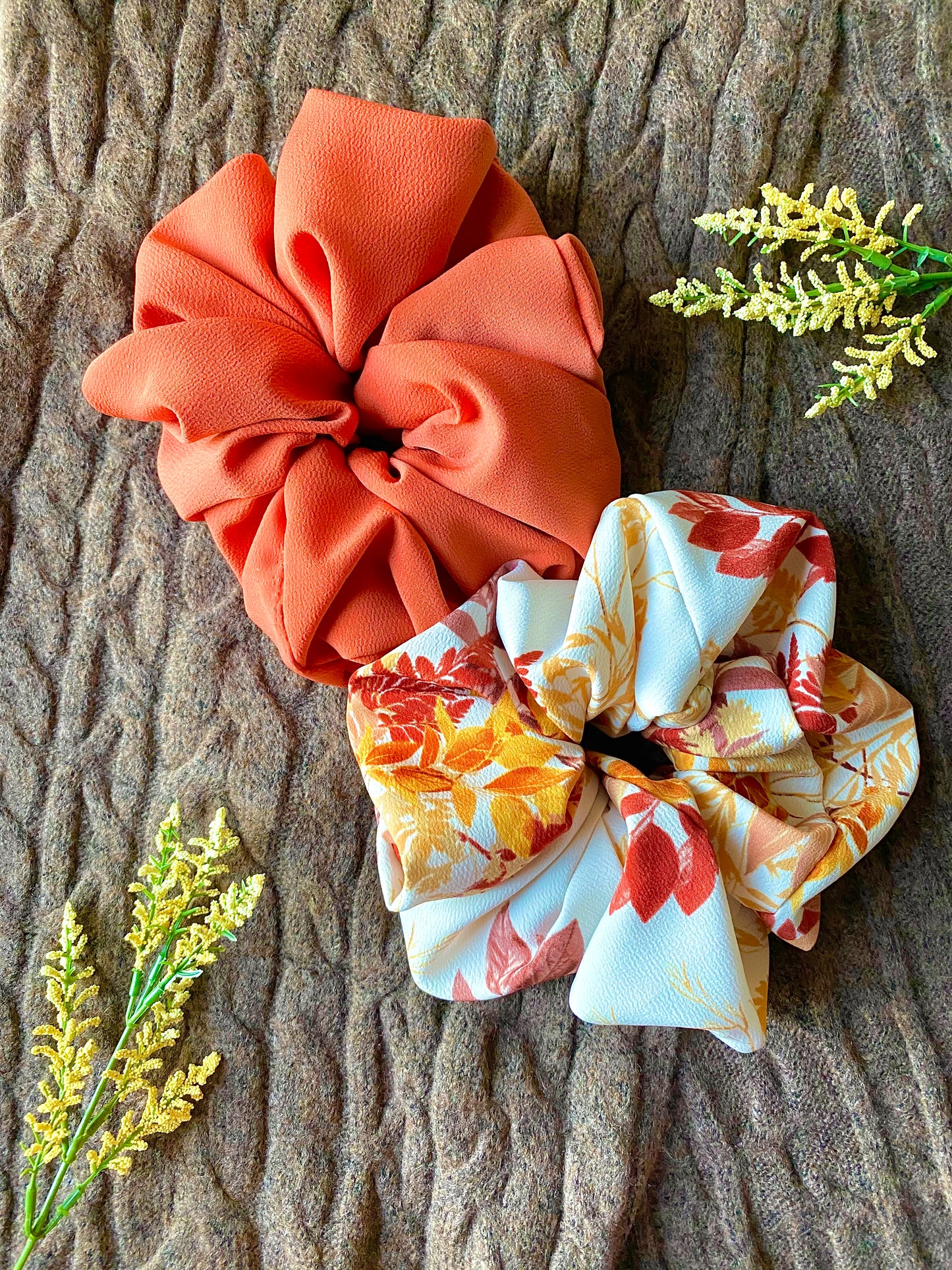 Orange, gold, red leaves displayed on this extra large scrunchie.
