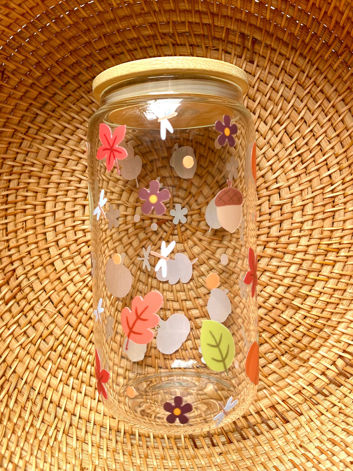Autumn inspired 16oz glass cup with fall leaves, acorns, flowers, and small details
