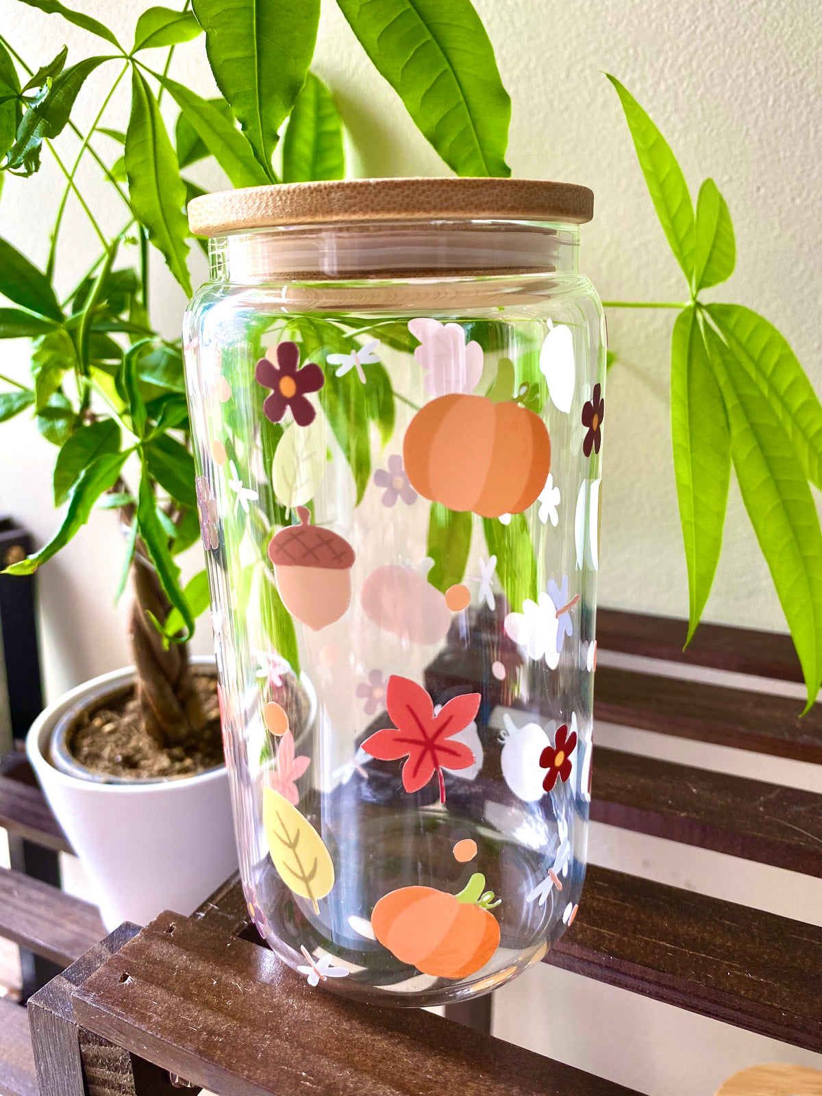 Autumn inspired 16oz glass cup with fall leaves, acorns, flowers, and small details