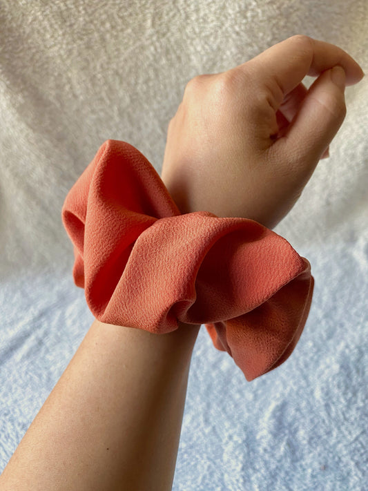 Medium, or classic, sized scrunchie. Bold, solid orange color. Perfect for Fall.